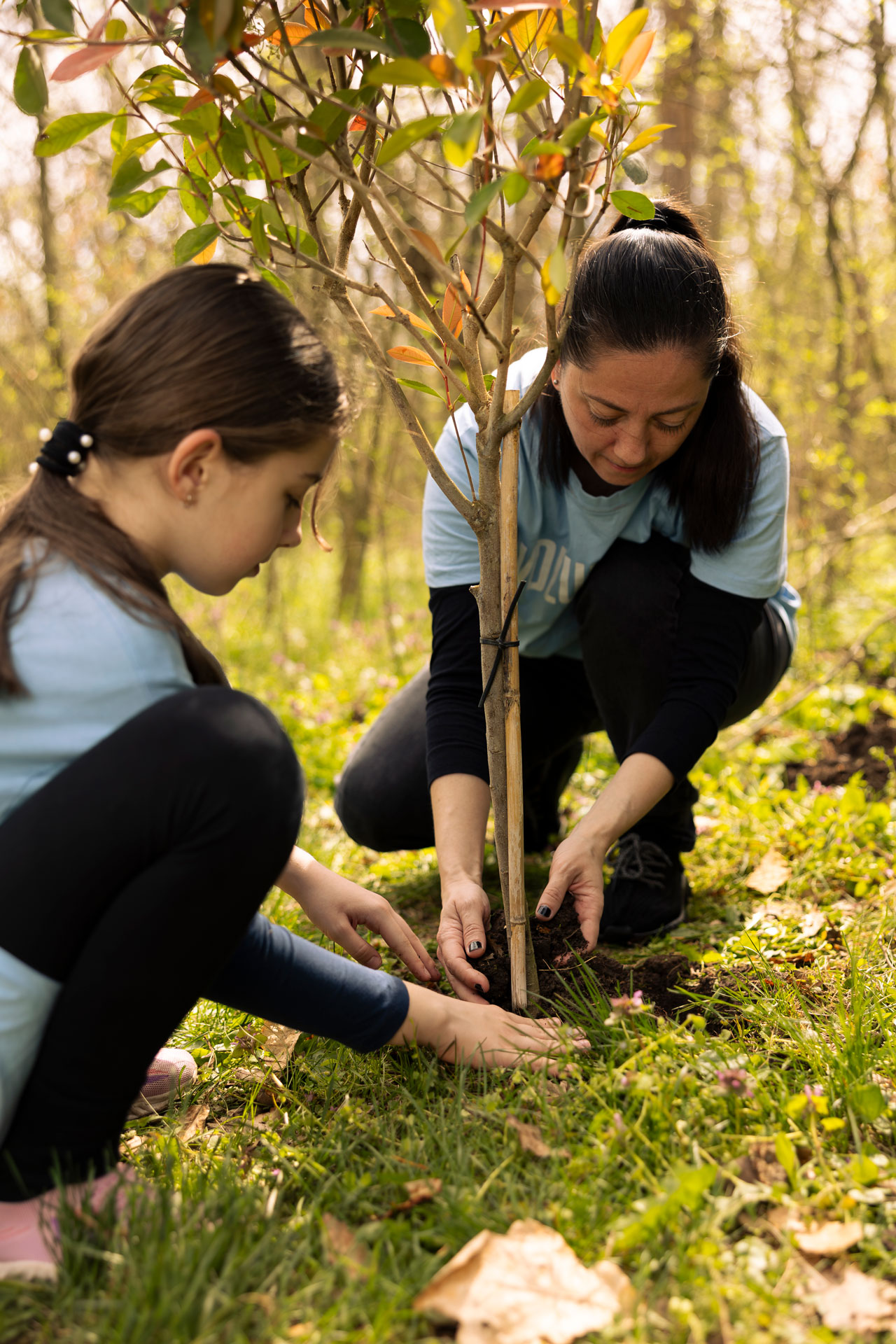 mom-and-her-little-kid-doing-voluntary-work-planti-2025-02-20-00-32-53-utc